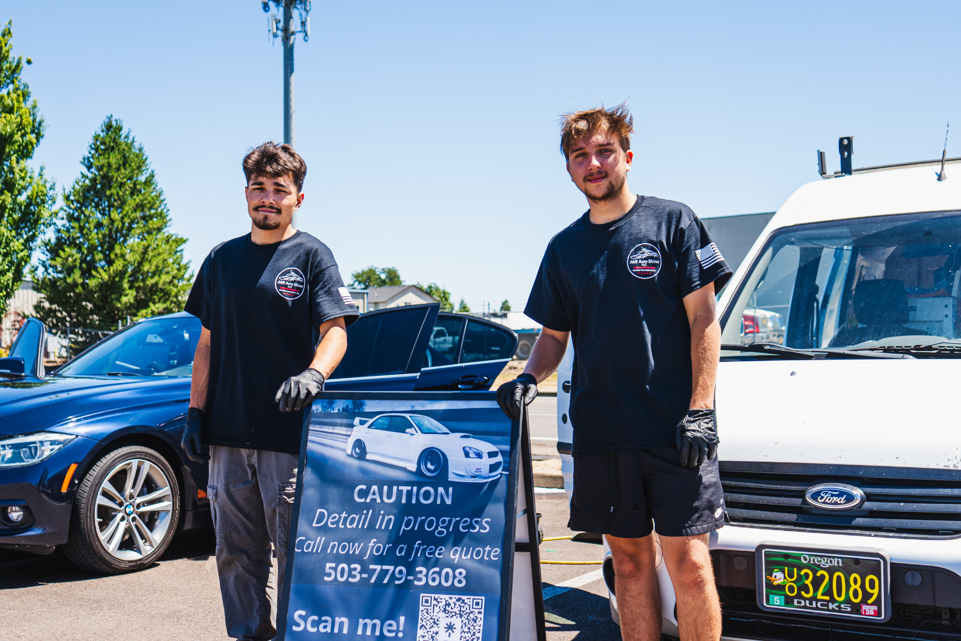 The A&B Auto Shine team beside their mobile detailing van